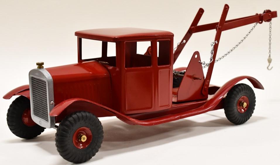 Restored Tri-Ang Wrecker Tow Truck: Professionally restored Tri-Ang wrecker truck. Displays very nicely with light wear from display and age. Measures approximately 22" long.