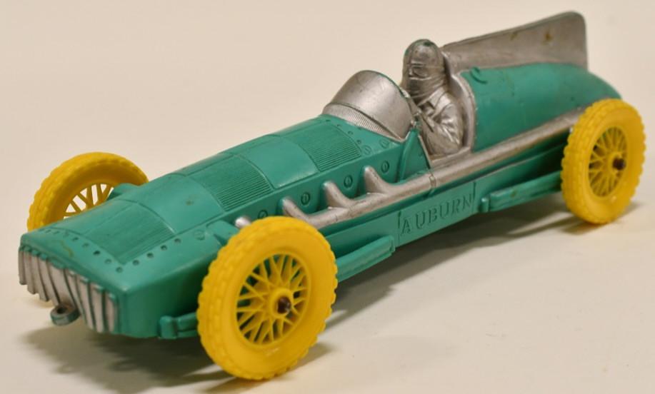 Vintage Auburn Rubber Indy Style Racer: Nice vintage mint green Auburn Rubber Indy Style racer. Displays nicely with some paint loss and wear from play and age. Measures approximately 10 1/2" long.