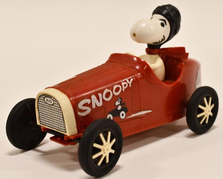 1970's Monogram Model's Snoopy and his Bugatti: Vintage 1970's Monogram Model's Snoopy and his Bugatti race car. The model is missing the front bumper. Displays nicely with wear from play and age. Measures approximately 6" long.