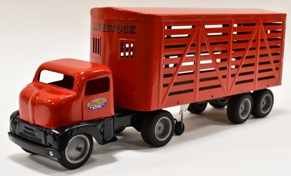 Custom Tonka Truck with Livestock Hauler Trailer: Custom Tonka Toys Livestock Truck and Trailer. Displays nicely with wear from display and storage. Nice restoration. Overall measures approximately 22" long.