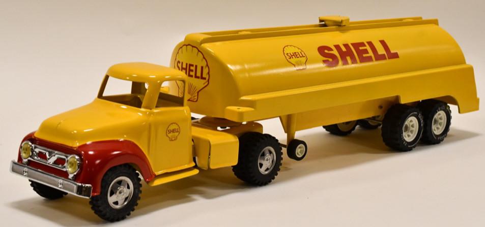 Custom Tonka Shell Tanker Truck w/ Trailer: Custom Tonka Shell tanker truck with trailer. Displays nicely with custom Shell decls. The trailer is plastic, and the truck is metal. Overall measures approximately 27 1/2" long.