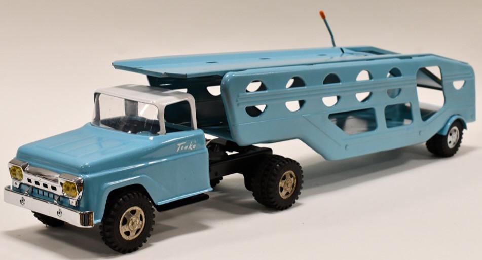 Custom Tonka Car Carrier Truck: Custom Tonka car carrier auto hauler truck with trailer. Displays nicely with a custom blue paint job. Has light wear from storage and display. Overall measures approximately 27 1/2" long.
