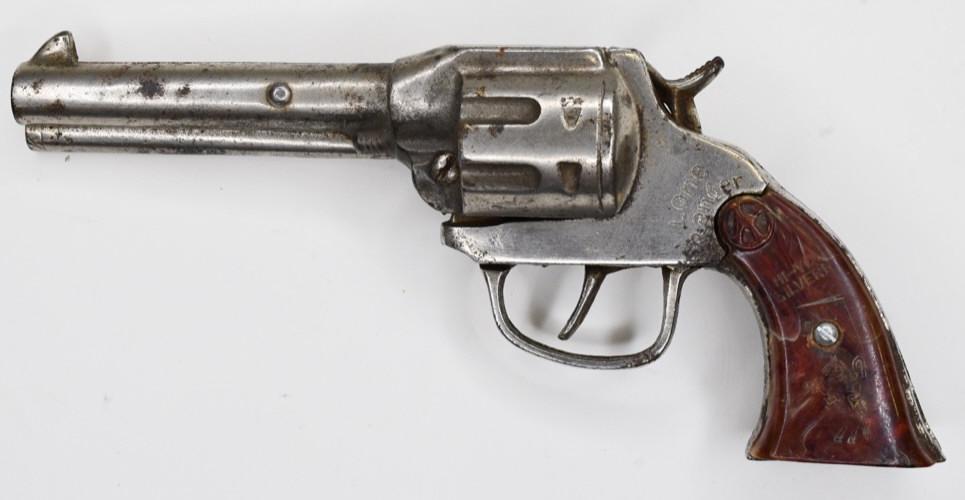 Kilgore Lone Ranger HI-YO Silver Cap Gun: Kilgore Lone Ranger HI-YO Silver cap gun pistol. Displays nicely with wear from play and age. The trigger works. The grip shows the Lone Ranger riding Silver . Measures approximately 8 1/2" long.
