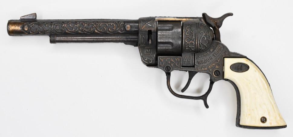 Leslie Henry Co. Wagon Train 44 Western Six-Gun: Leslie Henry Co.. Wagon Train 44 western six shooter cap gun. Displays nicely wiht some wear from age and play. Measures approximately 11" long.