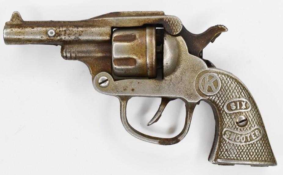 Kilgore Six Shooter Cast Iron Cap Gun: 1930's Kilgore Six Shooter cast iron cap gun. Displays nicely with wear from play and age. The trigger works. Measures approximately 6 1/2" long.