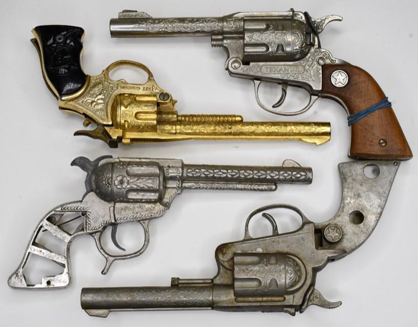 Lot of 4 Western Cap Gun for Parts or Repair: Lot of 4 western cap gun for parts. Lot includes a Hoplong Cassidy that is missing the grips, gold finish Kit Carson gun that is missing the trigger, Halco cap gun that is missing the grip, and Texan