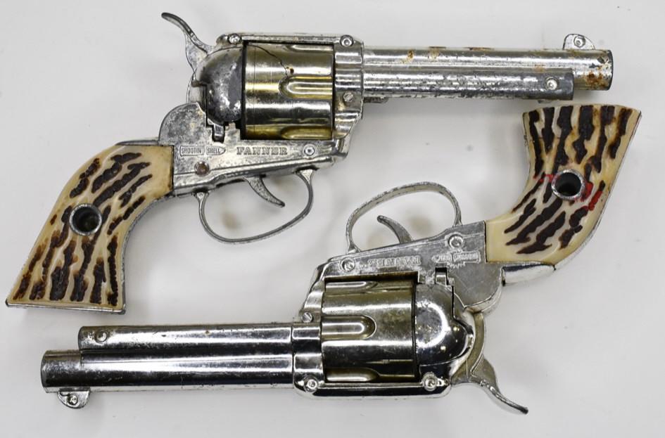 (2) Mattel Shootin' Shell Fanner Cap Gun Pistols: Lot of 2 Mattel Shootin' Shell Fanner cap gun pistols. The cylinder is cracked on the one. Both have wear from play and age. Both of the triggers work. Measures approximately 8 1/2" long.