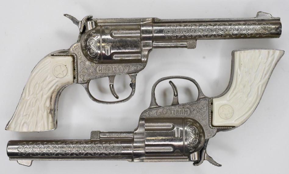Set of Hubley Rodeo Cap Gun Pistols: Nice set of Hubley Rodeo cap gun pistols. Set displays nicely with wear from use and age. Measures approximately 8" long.