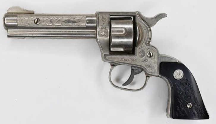 Nichols Stallion 32 Cap Gun Pistol: Nichols Stallion 32 cap gun pistol. Displays nicely with wear from use and age. The trigger works. Measures approximately 7 1/2" long.