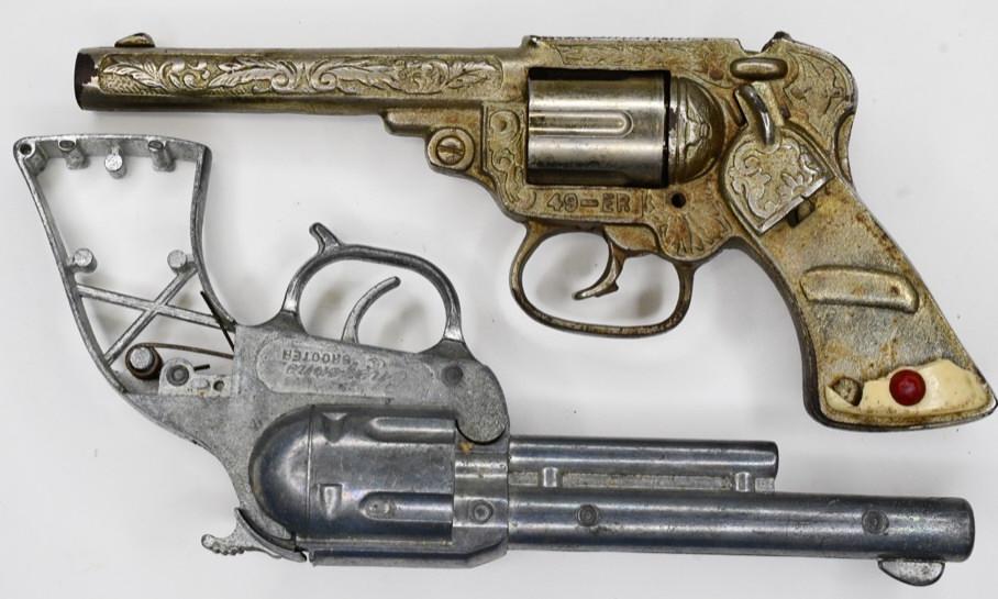 Steven's 49-ER& Hamilton Cheyenne Shooter Cap Guns: Lot of 2 cap gun pistols. Lot includes a Steven's 49-ER cap gun that needs new grips. Also included is a Hamilton Cheyenne Shooter cap gun that needs grips. Both of the triggers work. Largest measures