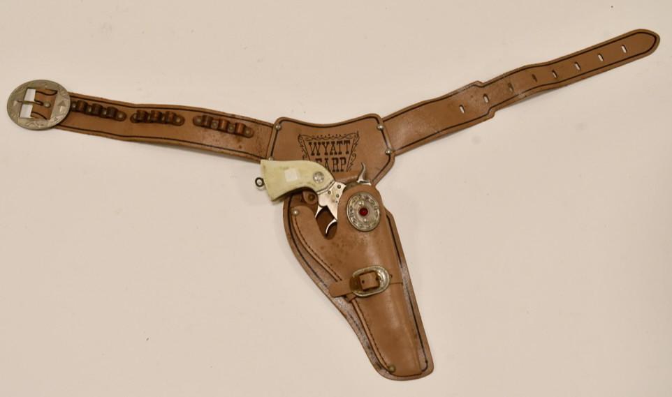 Actoy Wyatt Earp Cap Gun with Holster: Actoy Wyatt Earp Cap gun with Wyatt Earp Holster. The gun has a brake in the cilynder so the barrel tends to not want to stay in place. The trigger works. Displays well with an original Wyatt Earp hol