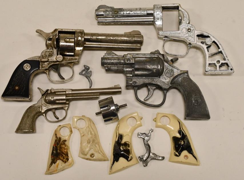 Lot of Nichols and Hubley Vintage Cap Gun Parts: Lot includes a Nichols Stallion 32 that needs repair to the trigger, Hubley Pet single shot, Kilgore Bulldog cap gun pistol, also includes some grips, and a Nichols Stallion 32 parts gun.