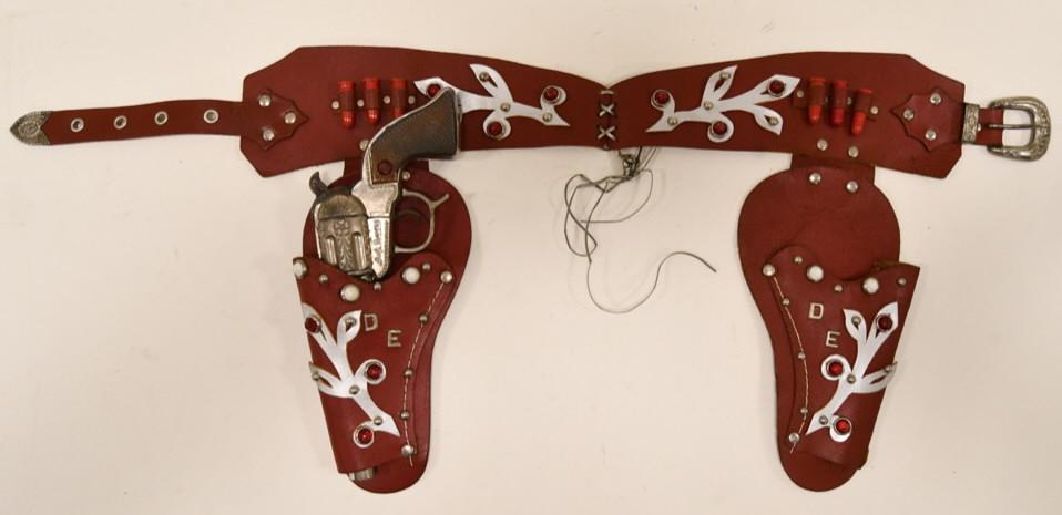 Geo. Schmidt Dale Evans Cap Gun with Holster: Nice Geo. Schmidt Dale Evans cap gun with jeweled leather holster. The string holding the belt together appears to have been replaced. The cap gun displays nicely with a jeweled grip. The gun has some
