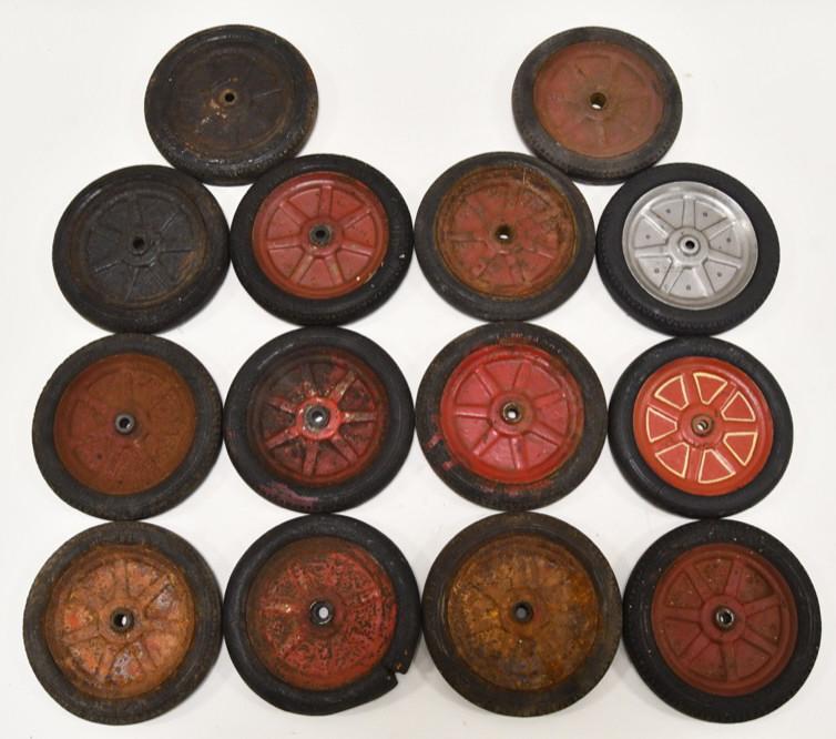 (14) Buddy L Firestone Spoked Rubber Balloon Tires: Lot of 14 Buddy L spoked rubber balloon tires. Some are reproduction ans some original. The original have cracking and wear from age. Measures 4 1/4" in diameter.