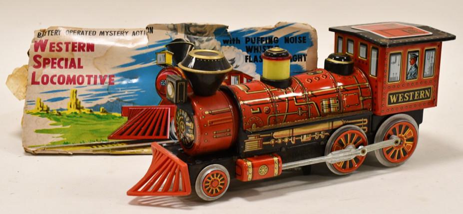Modern Toys Battery Op. Western Special Locomotive: Tin Litho battery Op. Modern Toys Western Special Locomotive train. Nice condition with the box. The box is in rough condition. Measure approximately 13" long.
