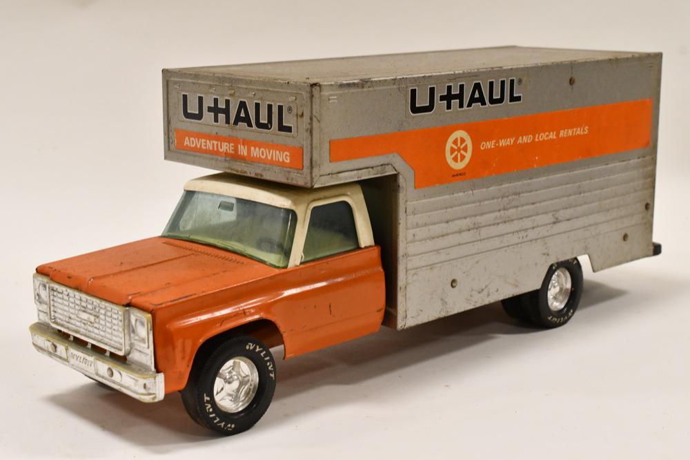 Nylint U-Haul Rental Maxi-Mover Ford Box Truck: Nylint U-Haul rental maxi-mover Ford box truck. Displays nicely with wear from play and age. The back door slides open and closes. Measures approximately 19" long.