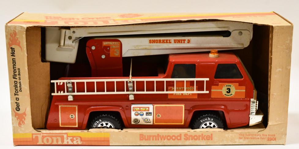 Tonka Burntwood Snorkel Fire Truck No. 2301: Tonka Burntwood Snorkel fire truck No. 2301 with the original box. Displays nicely with wear from display and age. The box has some staining and discoloration. The truck has some dust. Box measures ap