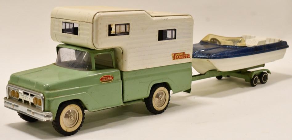 Tonka Cabover Camper Truck w/ Boat and Trailer: Original Tonka cabover camper truck with boat and trailer. The trailer is missing the winch. Displays nicely with wear form play and age. Overall measures approximately 28" long.