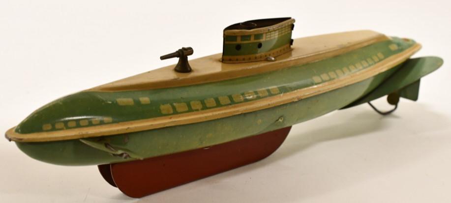 Wolverine Tin Litho Windup Submarine: Wolverine tin litho windup submarine. It is missing the windup key. Displays nicely with wear from play and age. Measures approximately 13" long.