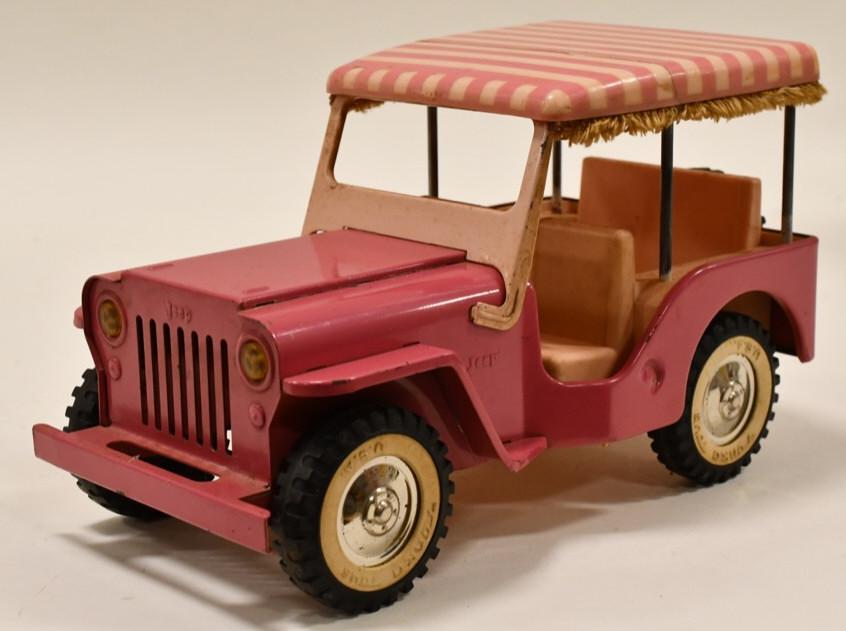 Pink Tonka Jeep Surrey: Original pink Tonka Jeep Surrey No. 350. The plastic hard top is cracked. Has wear from play and age. Displays nicely. Measures approximately 10 1/4" long.