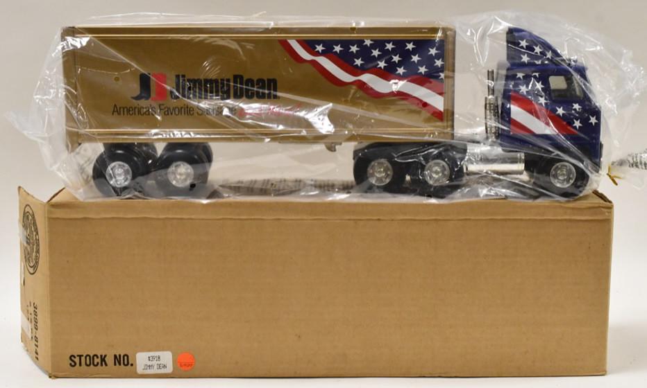 Ertl Jimmy Dean Sausage Semi Truck and Trailer: New in the box Ertl Jimmy Dean Sausage semi truck and trailer. The truck still has the plastic bag on it. Measures approximately 22" long.