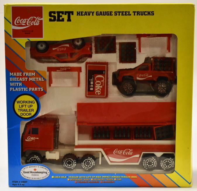 Remco Coca-Cola Truck Set: Remco Coca-Cola truck set in the box. Comes with a pickup truck, car, semi, and accessories. Nice condition. Box measures approximately 12 1/2" long by 12 1/2" tall.