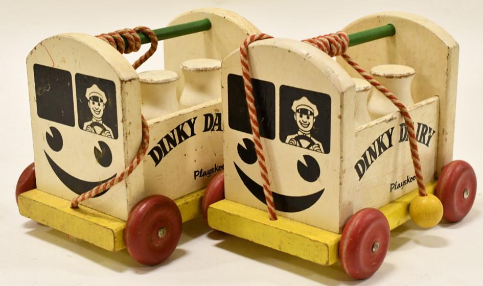Playskool Dinky Dairy Wood Pull Toy: Playskool Dinky Dairy wood pull toy. Has paint loss and wear from play and age. Measures approximately 9 1/2" long.