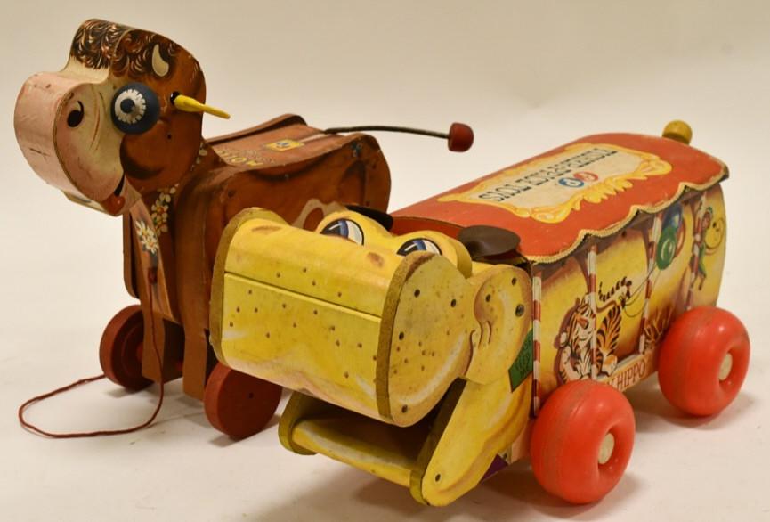 Fisher Price Molly Moo Moo & Happy Hippo Wood Toys: Fisher Price Molly Moo Moo #190 and Fisher Price Happy Hippo #151 wooden pull toys. Both have wear from play and age. Largest measures approximately 14 1/2" long.