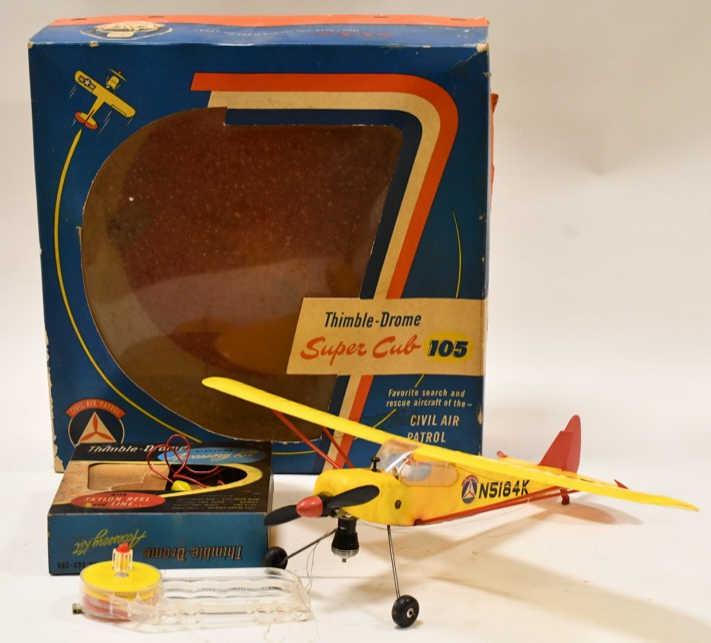 Thimble-Drome Super Bub 105 Civil Air Patrol: Thimble-Drome Super Bub 105 Civil Air Patrol gas powered plane in the box. Plane is untested. Displays nicely with wear from storage and display. Wingspan measures approximately 17 1/2" long.