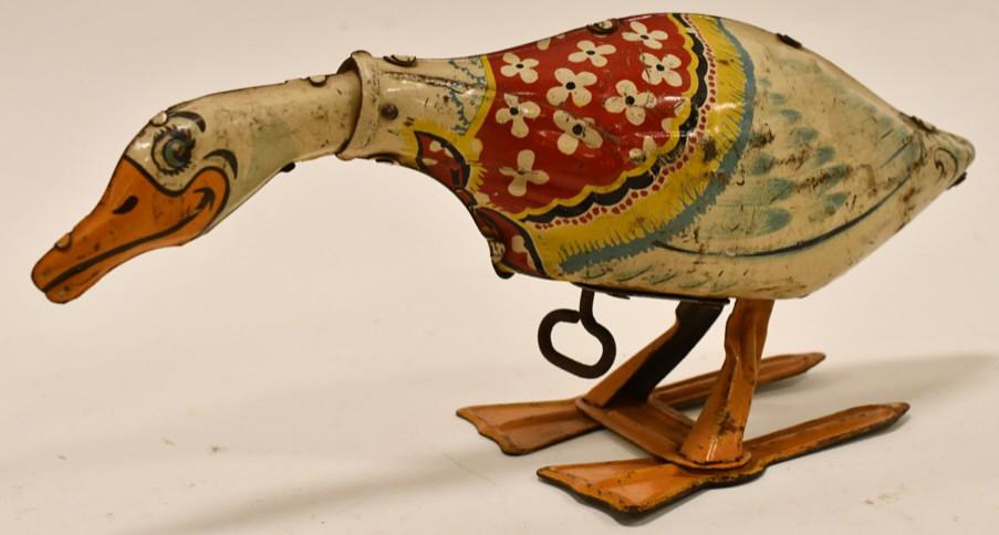 Unique Art Tin Windup Gertie the Galloping Goose: Unique Art tin litho windup Gertie the Galloping Goose. Nice condition with some paint loss and wear from play and age. The windup mechanism needs some work. Measures approximately 8 1/2" long.