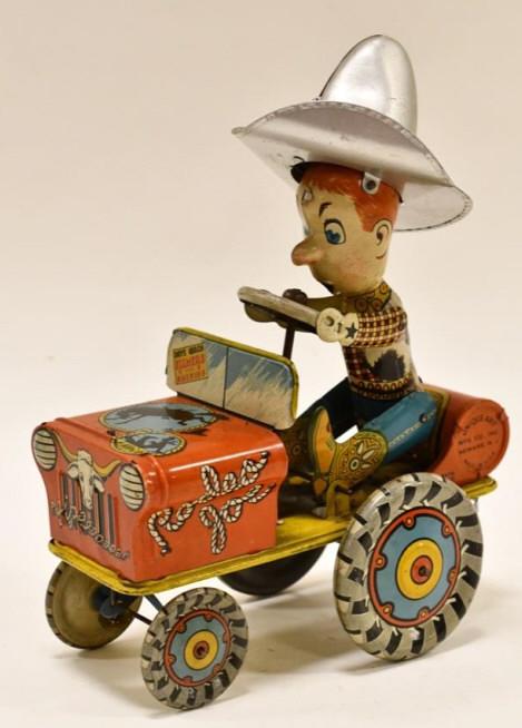 Unique Art Tin Litho Windup Rodeo Joe: Unique Art tin litho windup Rodeo Joe. Displays nicely with wear from age and play. Has paint loss and scratches. WIndup needs some work. The back wheels are loose. Measures approximately 9 1/2" tall.