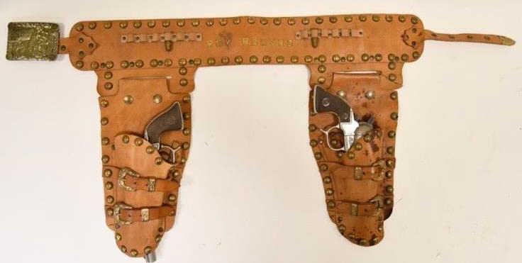Geo Schmidt Roy Rogers Cap Gun Set with Holster: Geo Schmidt Roy Rogers cap gun set dual tooled leather holster. The dual holster displays nicely with metal Roy Rogers on the belt between the holsters. The cap guns are in nice condition with some li