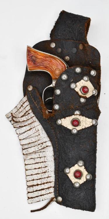 Hubley Rodeo Cap Gun with Single Holster: Hubley Rodeo cap gun with single holster. Displays nicely with wear from play and age. The trigger works. Gun measures approximately 7 1/2" long.