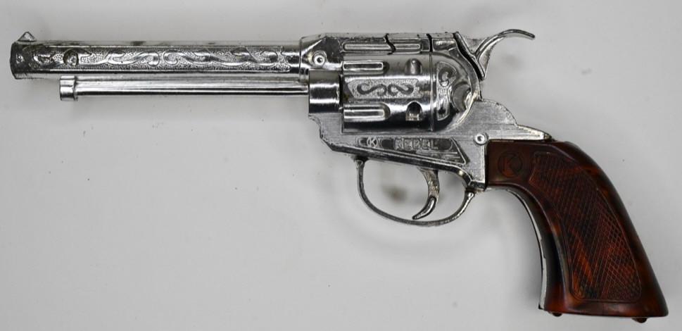 Kilgore Rebel Cap Gun Pistol: Kilgore Rebel cap gun pistol. Displays nicely with some wear from play and age. The trigger works. Gun measures approximately 10 1/2" long.