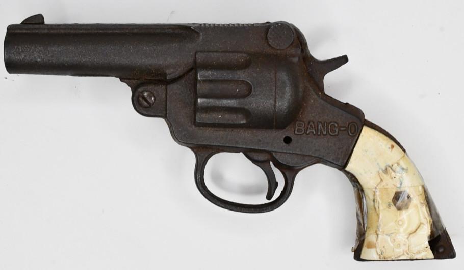 Stevens Cast Iron Bang-O Cap Gun Pistol: Stevens cast metal Bang-O cap gun pistol. Displays nicely with some wear from play and age. The grips are cracked, and are being held on by tape. The trigger does not work. Gun measures approximately