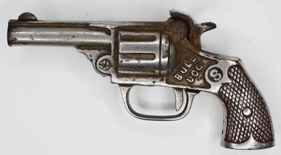 Kenton Cast Iron Bull Dog Cap Gun Pistol: Kenton cast iron Bull Dog single shot cap gun pistol. Displays nicely with wear from age and play. The trigger works. Gun measures approximately 5 1/2" long.