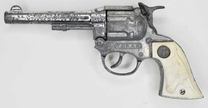 Long Island Die Cast Texas Cap Gun Pistol: Long Island Die Cast Texas cap gun pistol. Nice condition with wear from play and age. The trigger works. Measures approximately 8 1/2" long.