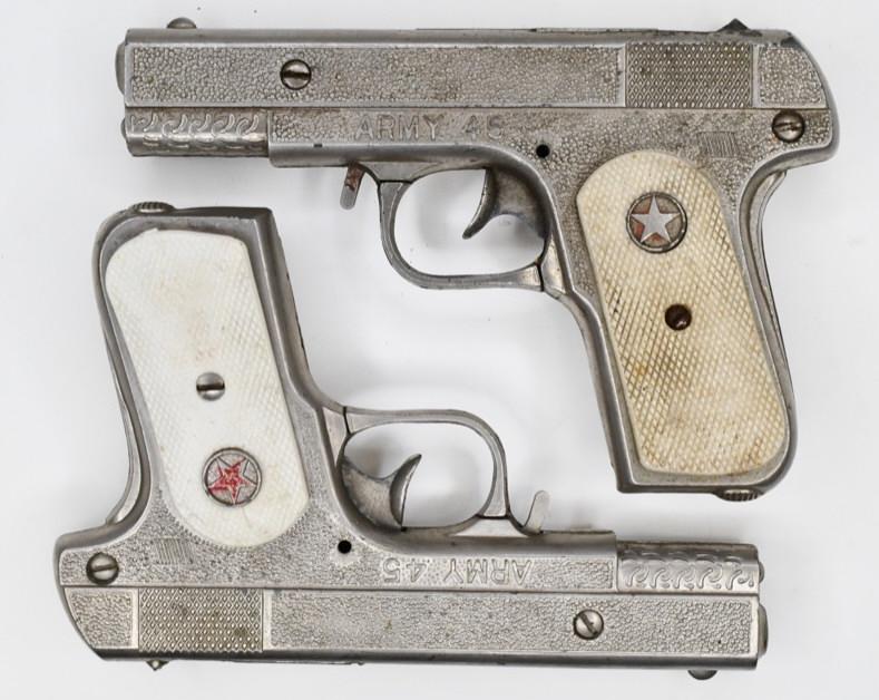Pair of Hubley Army 45 Cap Gun Pistol: Pair of Hubley Army 45 cap gun pistols. Nice condition with wear from play and age. Both triggers work. Each gun measures approximately 6 1/2" long.