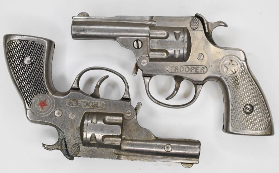 Pair of Hubley Trooper Cap Gun Pistols: Pair of Hubley Trooper cap gun pistols. Nice condition with wear from play and age. Both triggers do not work. Each gun measures approximately 6 1/2" long.