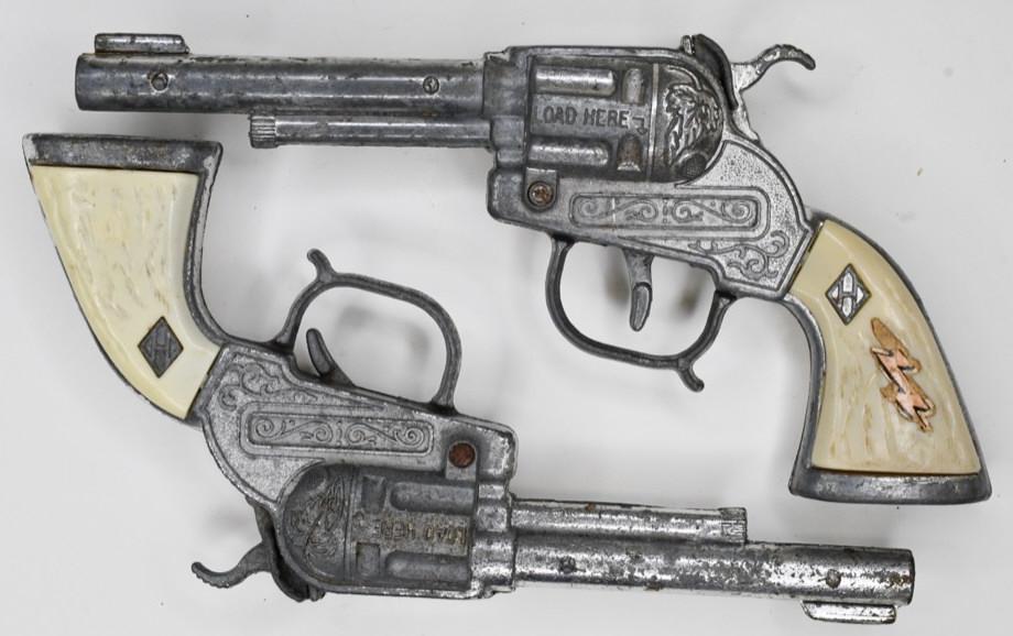 Pair of Halco Cap Gun Pistols: Pair of Halco cap gun pistols. Nice condition with wear from play and age. One trigger works, and the other does not. Each gun measures approximately 8" long.