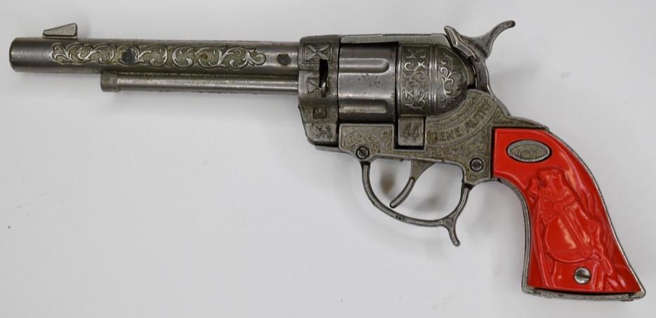 Leslie-Henry Gene Autry 44 Cap Gun Pistol: Leslie-Henry Gene Autry 44 cap gun pistol. Displays nicely with wear from play and age. The trigger works. Gun measures approximately 10 1/2" long.