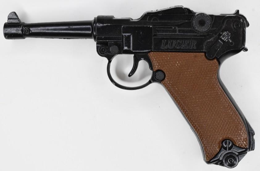 Crescent Toy Co. Luger Cap Gun Pistol: Crescent Toy Co. Luger cap gun pistol. The pistol displays nicely with some paint loss and wear from play and age. The trigger works, but does stick. Gun measures approximately 6 1/2" long.