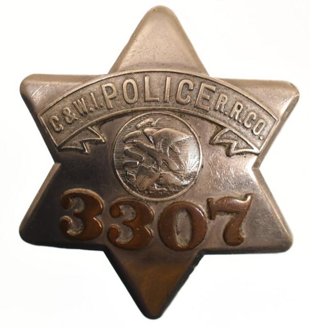 Obsolete C&W.I. R.R. Co. Police Pie Plate Badge: Nice early obsolete Chicago and Western Indiana Railroad Police "Pie Plate" badge no.3307 with copper numbers. Badge is in nice condition with wear from use and age. Has pinback. Back is marked "C.H.H
