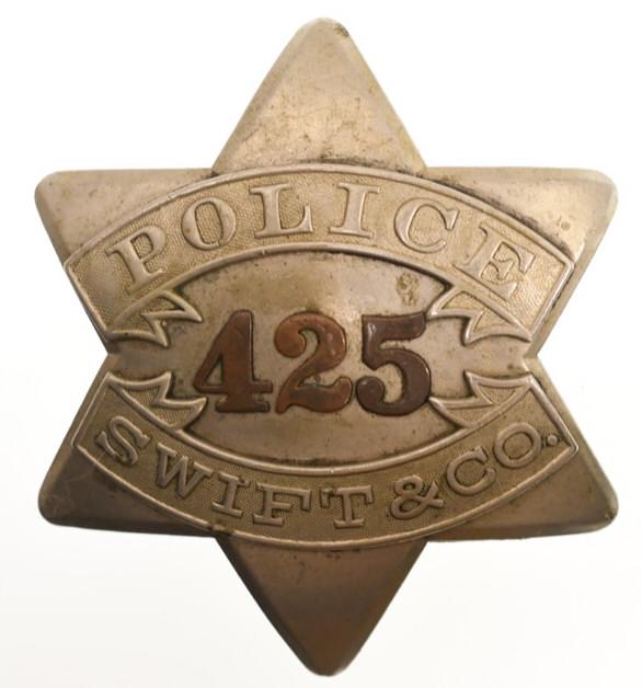 Early Swift & Co. Police Pie Plate Badge No.425: Nice early obsolete Swift & CO. Meat Packing House Police "Pie Plate" badge no.425 with copper numbers. Badge is in nice condition with wear from use and age. Has pinback. Back is marked "C.H. Hanson