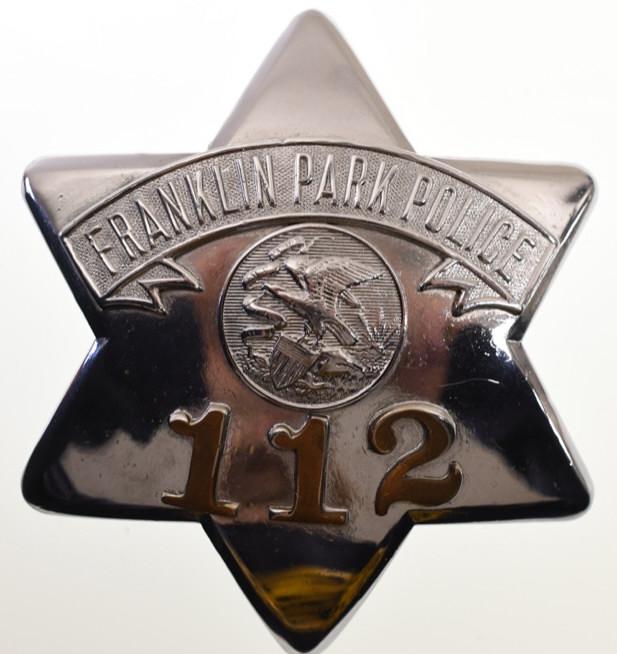 Obsolete Franklin Park Police Pie Plate Badge #112: Nice early obsolete Franklin Park Police "Pie Plate" badge no.112 with copper numbers. Badge is in nice condition with wear from use and age. Has pinback. Back is marked "C.H. Hanson Chicago" It measu
