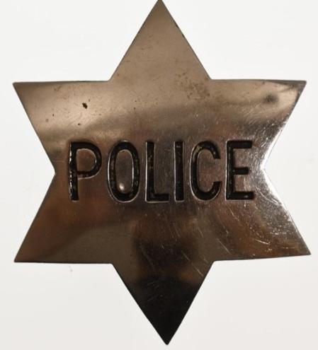 Early Obsolete 6-Point Star Police Badge: Nice early obsolete 6-Point Star Police badge. Badge is in nice condition with wear from use and age. Has pinback. Back is unmarked. It measures approximately 2-1/2" tall by 2" across.