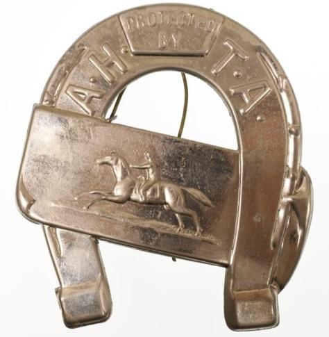 Obsolete Anti Horse Thief Association Saddle Badge: Nice obsolete Anti Horse Thief Association Saddle Badge. Badge is in nice condition with wire ties. Back is unmarked. It measures approximately 3-3/4" tall x 3-1/2" across.