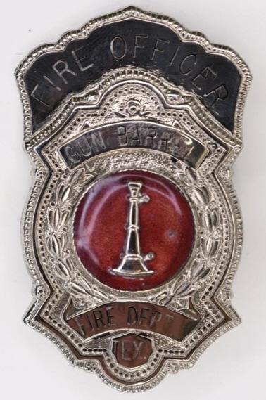 Obsolete Gun Barrel Texas Fire Dept. Officer Badge: Nice vintage Gun Barrel Texas Fire Department Fire Officer Badge. The badge is in nice condition with a small flake in the enamel, has a pinback. Measures approx 3" tall x 1-3/4" across.