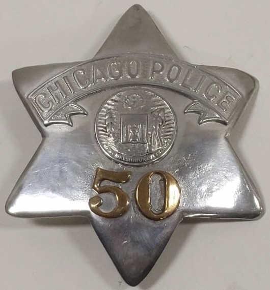 Obsolete Chicago Police Pie Plate Badge No. 50: Obsolete Chicago Illinois Police Pie Plate Badge no.50. Badge is in worn condition with new pinback added. Appears to have been heavily buffed and polished. Back is marked "C.H. Hanson". It measures a