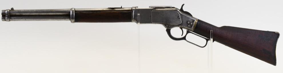 Winchester Model 1873 .38 Cal. Trapper Carbine: Winchester Model 1873 Trapper lever action carbine in .38 caliber. The carbine has a 16" round barrel and is in good used condition with heavy wear. Manufactured in 1892. Serial #433388. (77)